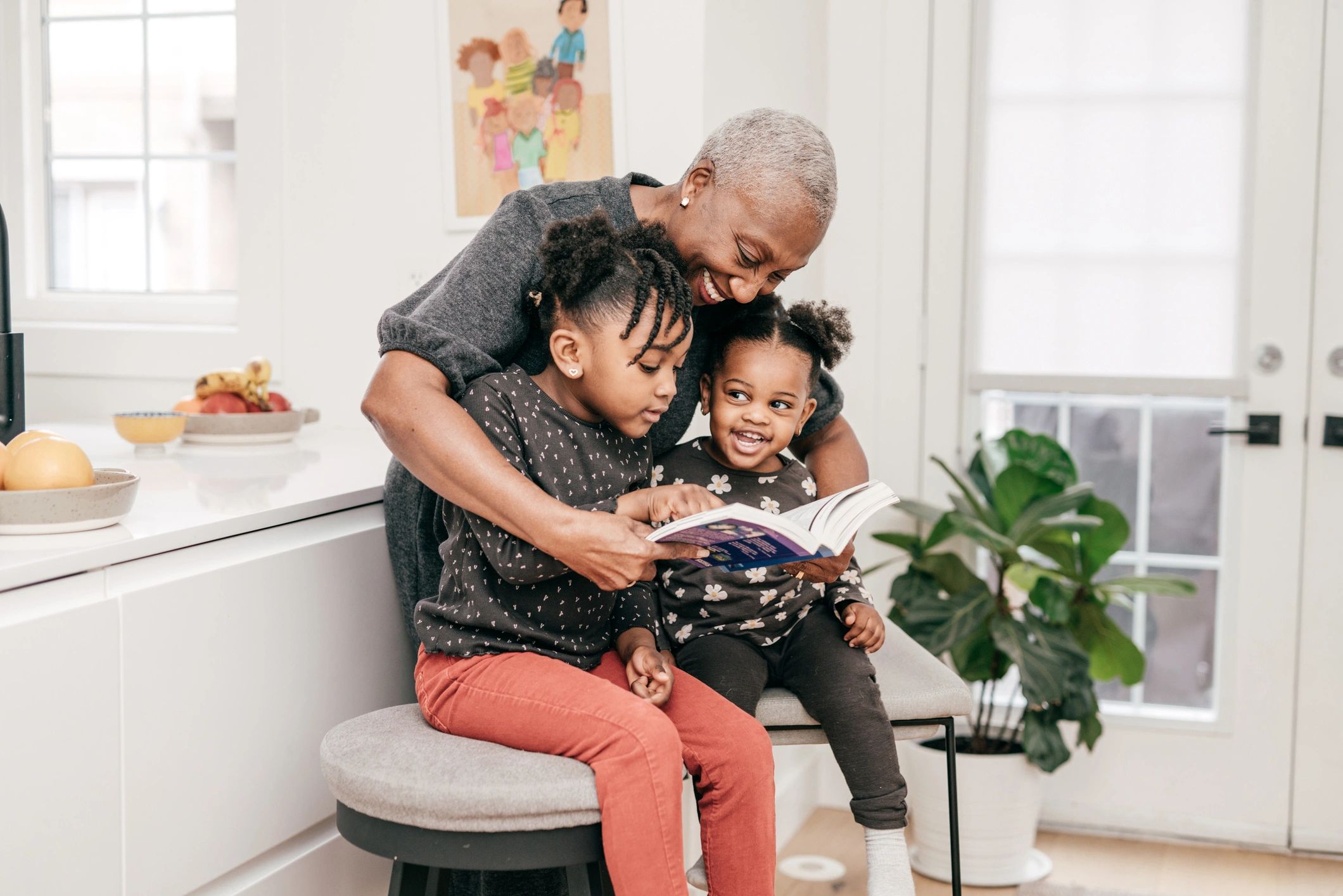 Grandmother reading to toddlers