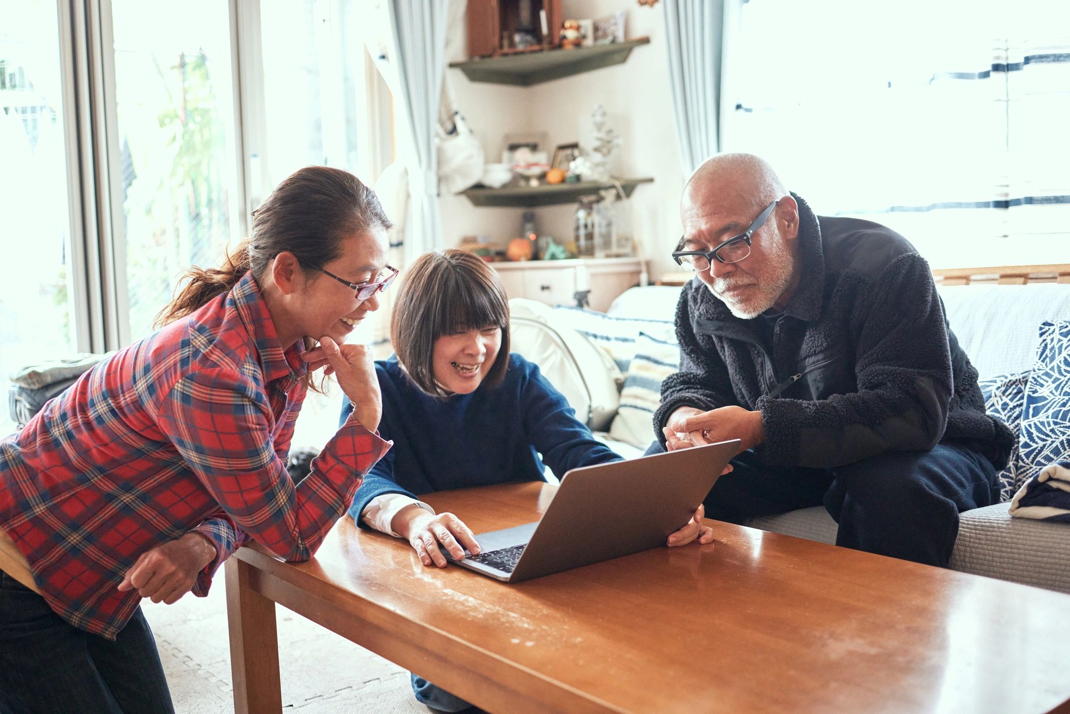 People gathered around a computer