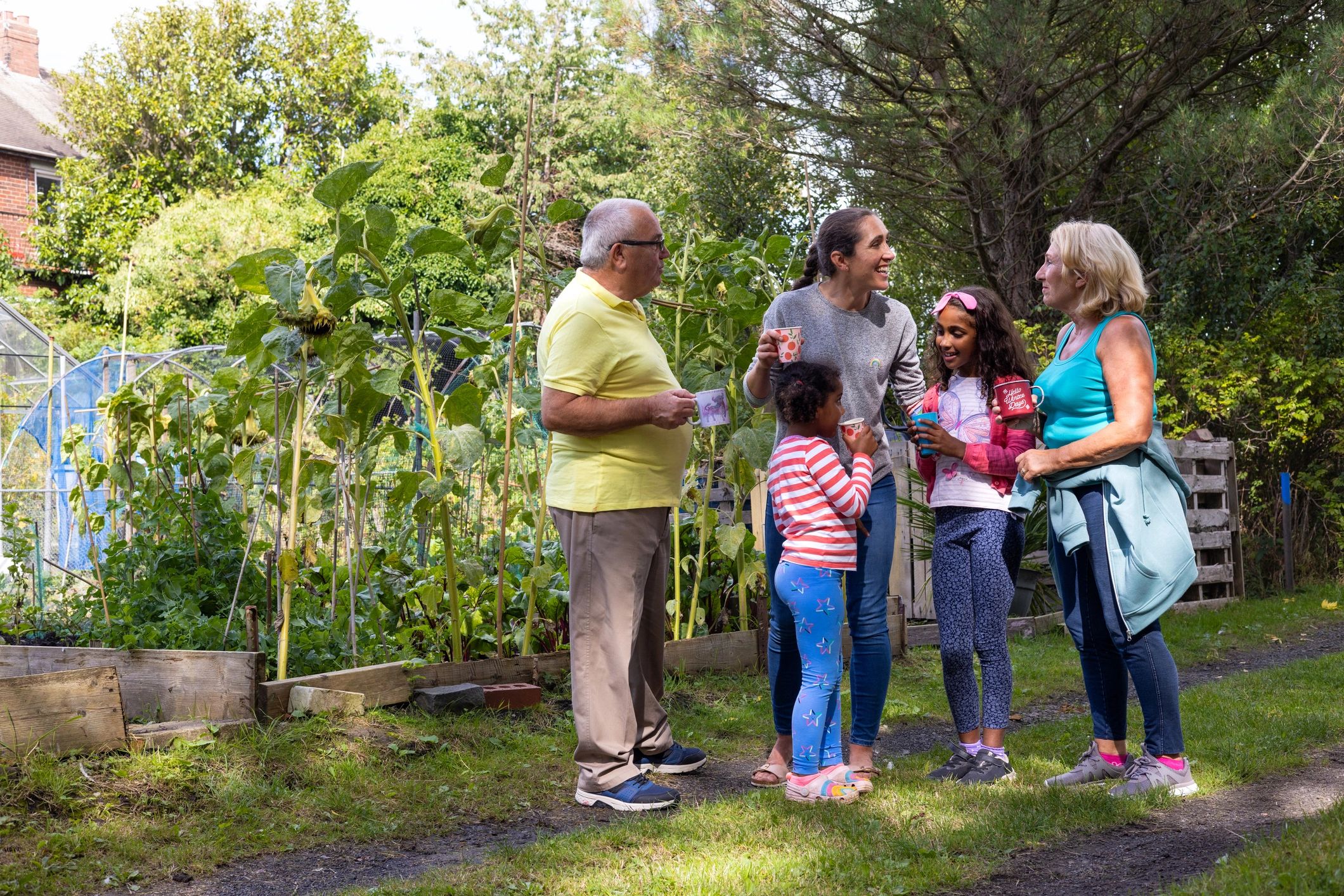 Family taking a break from gardening together