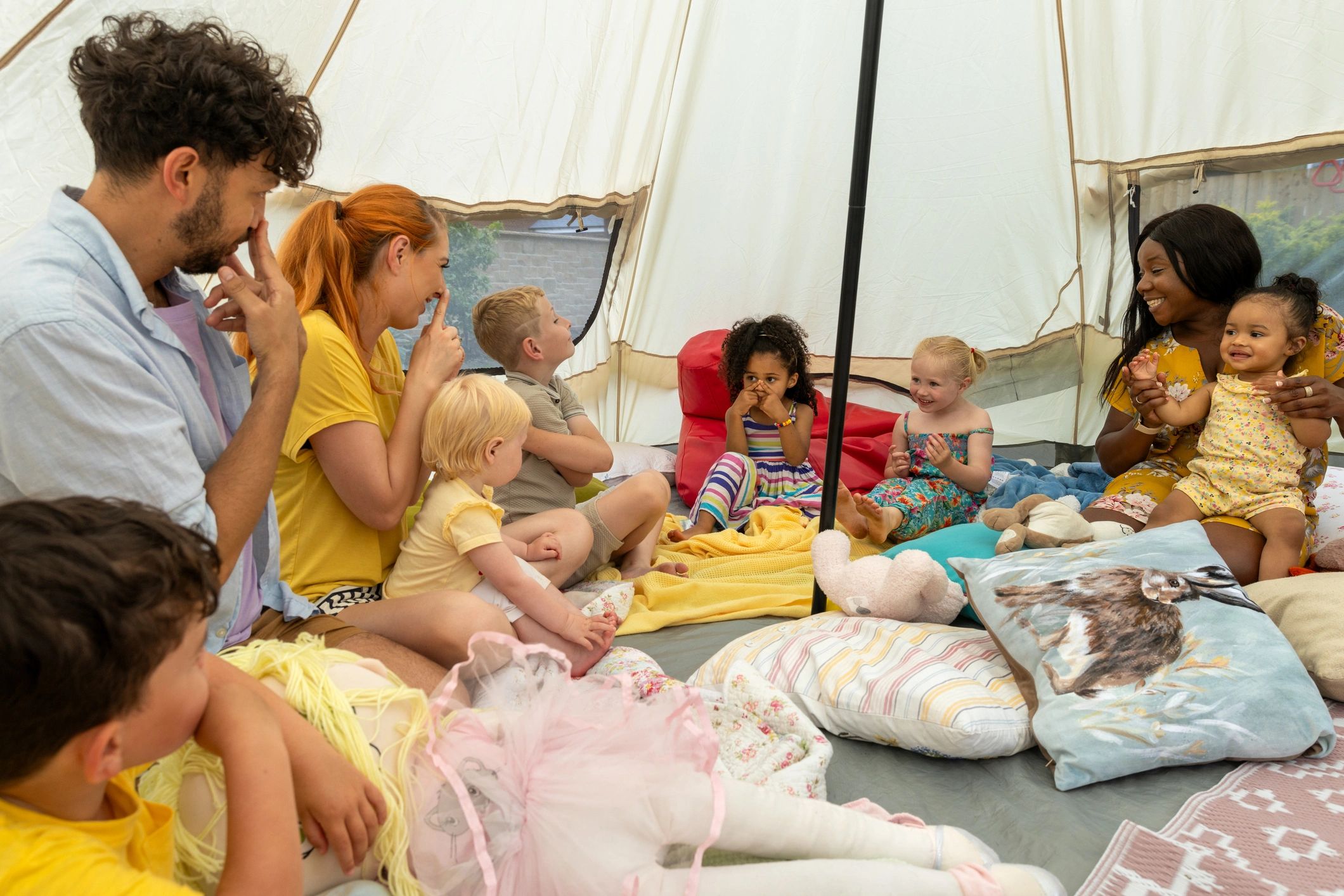 Families and children sharing a warm storytelling moment together
