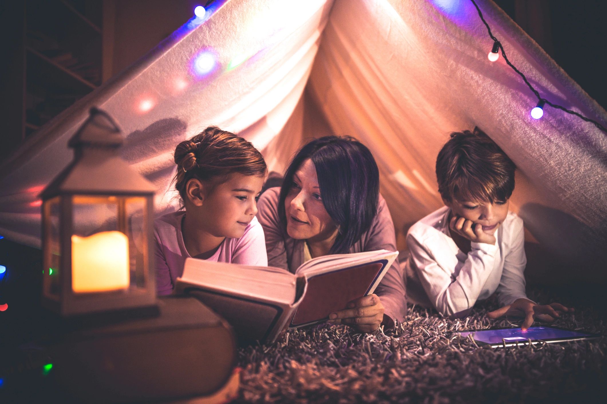 Parent and child reading together in a cozy setting